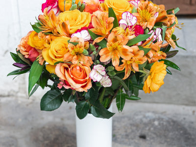 My Favorites flower bouquet with ranunculus, alstroemeria, hebes, roses, and solomio in a vase