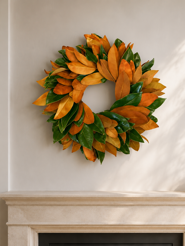The Festive Wreath, an 18-inch fresh magnolia wreath, styled above a limestone fireplace mantel