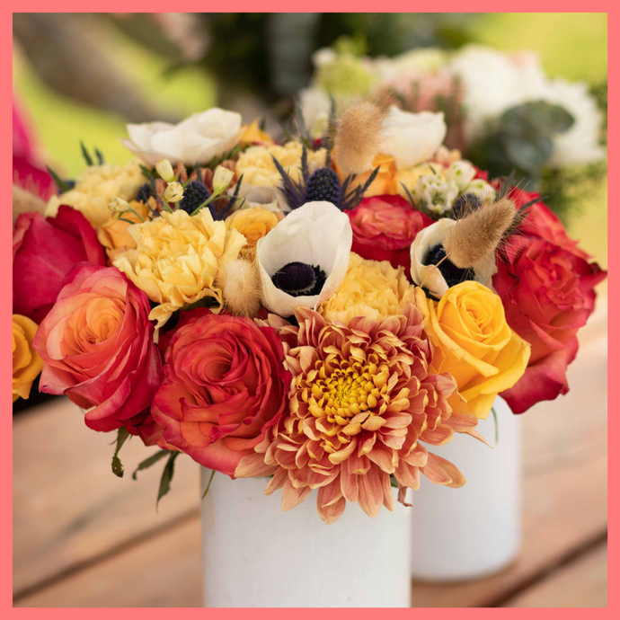 The Harvest Festival bouquet includes mixed stems of roses, anemone, delphinium, eryngium, chrysanthemums, bunny tail, and carnation!