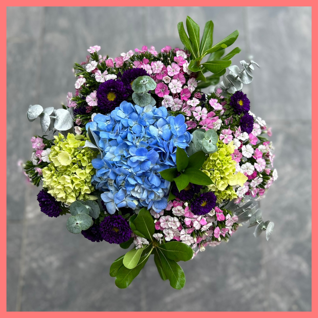 The Holiday Hugs bouquet includes mixed stems of hydrangea, mini hydrangea, matsumoto, dianthus, ruscus, eucalyptus, pittosporum! Please note that as flowers are a live product, colors, and varieties may slightly vary from the photos shown to provide you with the freshest and most beautiful bouquet.