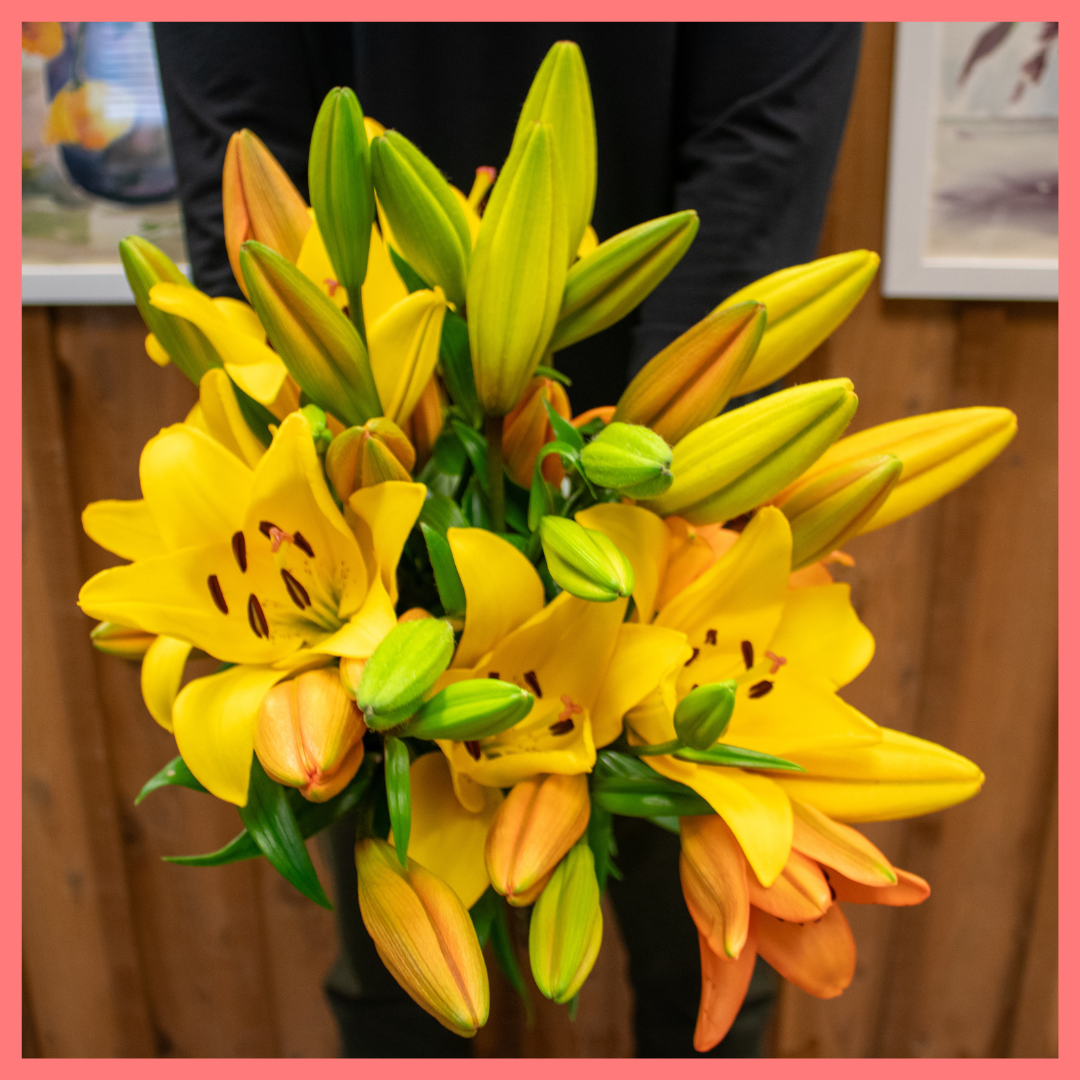 The Lovable Lilies bouquet includes 12 mixed stems of Yellow and Orange Lilies!