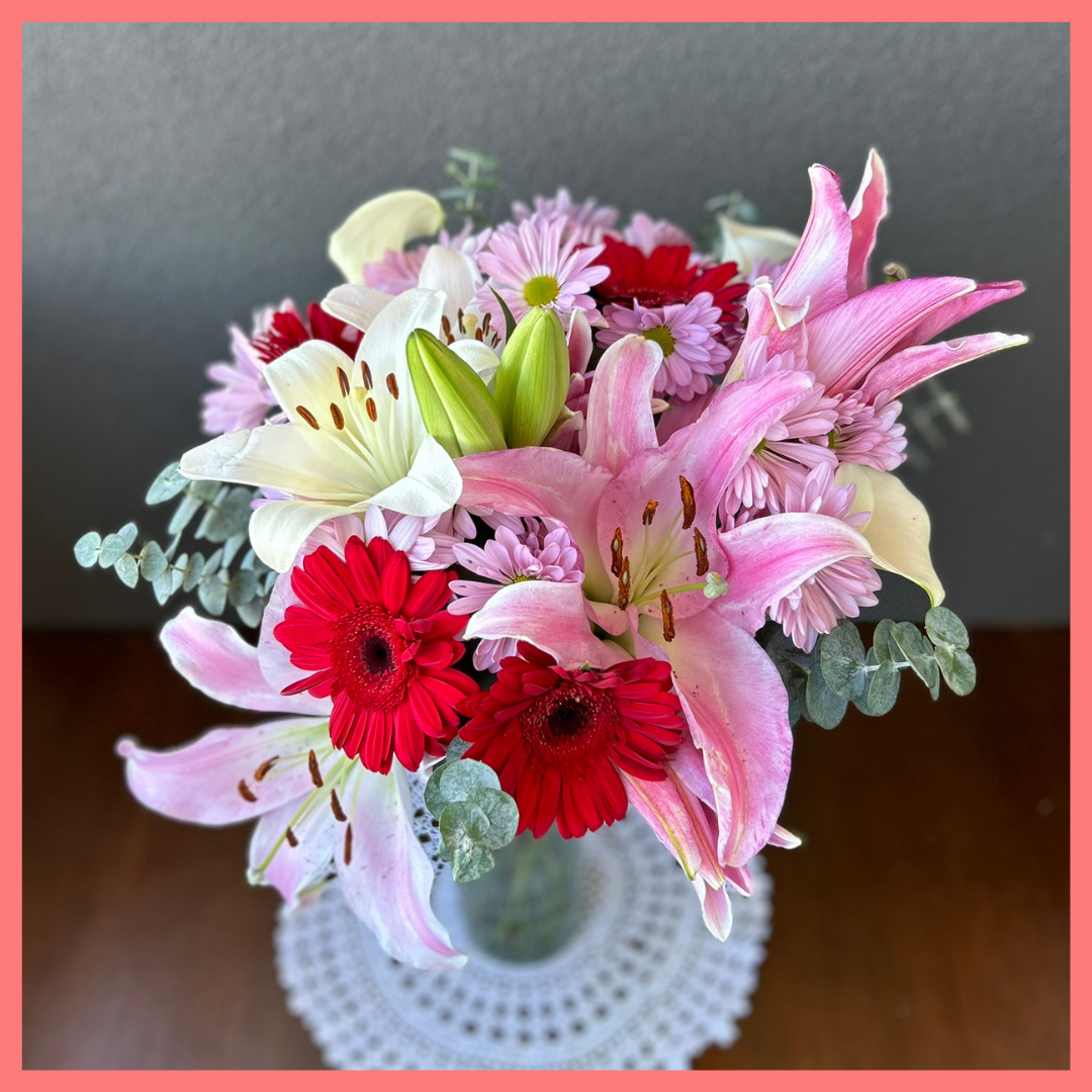 The Oh Hey Cupid bouquet includes mixed stems of lilies, oriental lilies, mini calla lilies, gerbera daisies, pompons, and baby blue eucalyptus! Please note that as flowers are a live product, colors, and varieties may slightly vary from the photos shown to provide you with the freshest and most beautiful bouquet.