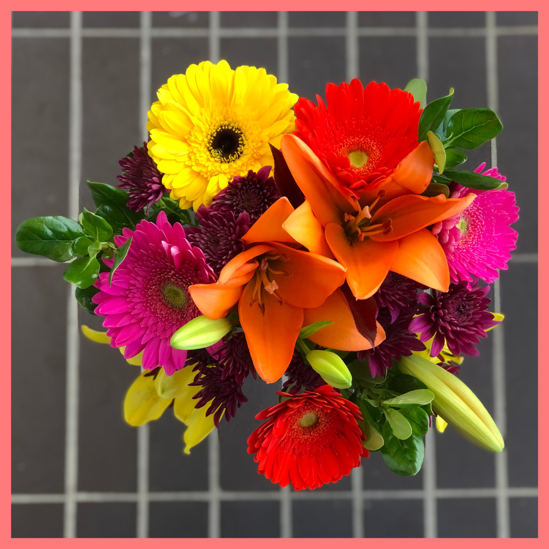  The Rainbow Snowcone bouquet includes mixed stems of lilies, gerbera daisies, CDN pompoms, photinia, and brillantina!
