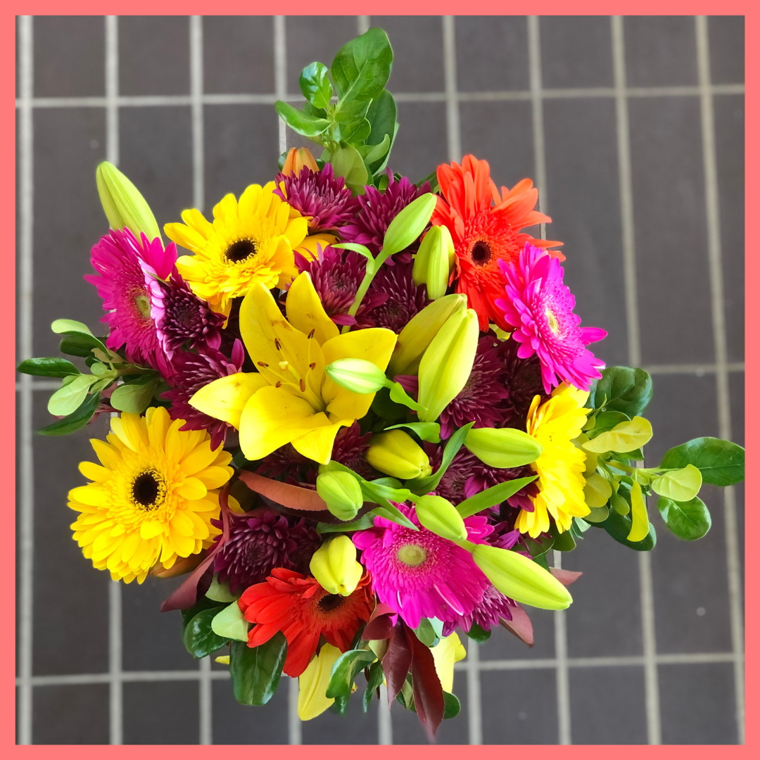  The Rainbow Snowcone bouquet includes mixed stems of lilies, gerbera daisies, CDN pompoms, photinia, and brillantina!