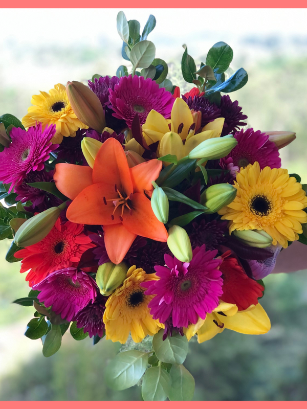  The Rainbow Snowcone bouquet includes mixed stems of lilies, gerbera daisies, CDN pompoms, photinia, and brillantina!