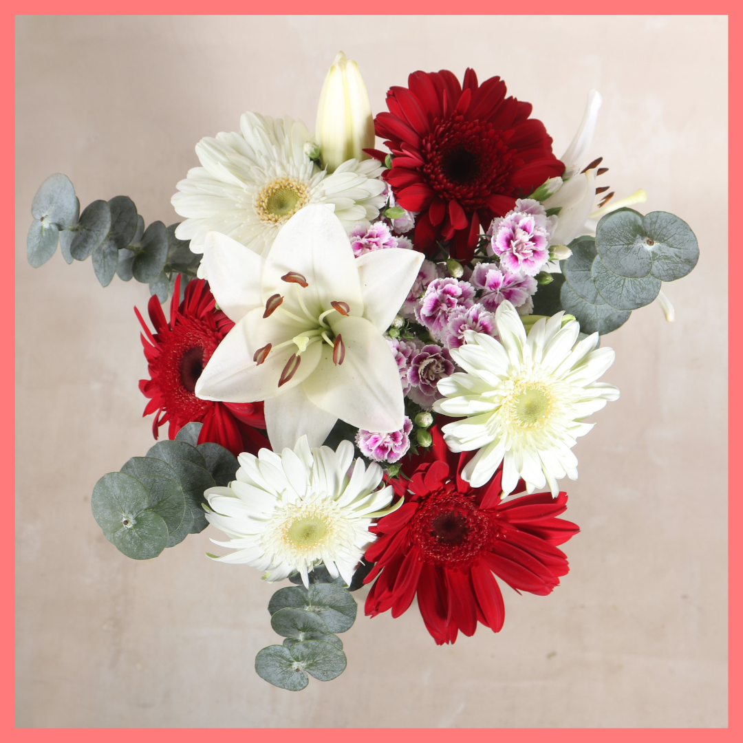 The Snow Angel bouquet includes mixed stems of lilies, gerbera daisies, raffine, and eucalyptus! Please note that as flowers are a live product, colors and varieties may slightly vary from the photos shown to provide you with the freshest and most beautiful bouquet.