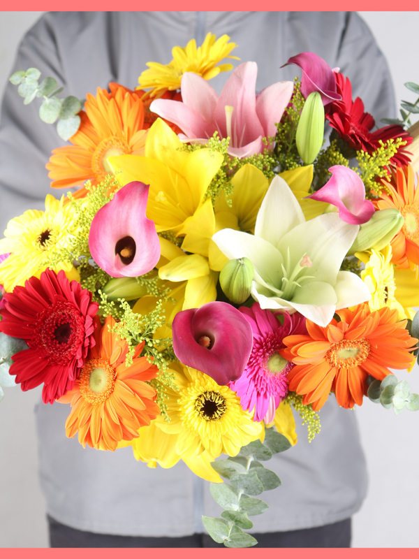 The Summer Breeze bouquet includes mixed stems of eucalyptus, lilies, gerbera daisies, mini calla lilies, and aster! Please note that as flowers are a live product, colors, and varieties may slightly vary from the photos shown to provide you with the freshest and most beautiful bouquet.