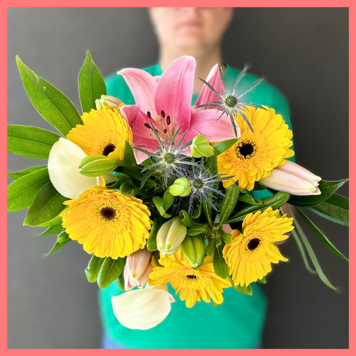 The XOXO bouquet includes mixed stems of lilies, gerbera daisies, mini calla lilies, eryngium, cocculus, and pittosporum! Please note that as flowers are a live product, colors, and varieties may slightly vary from the photos shown to provide you with the freshest and most beautiful bouquet.