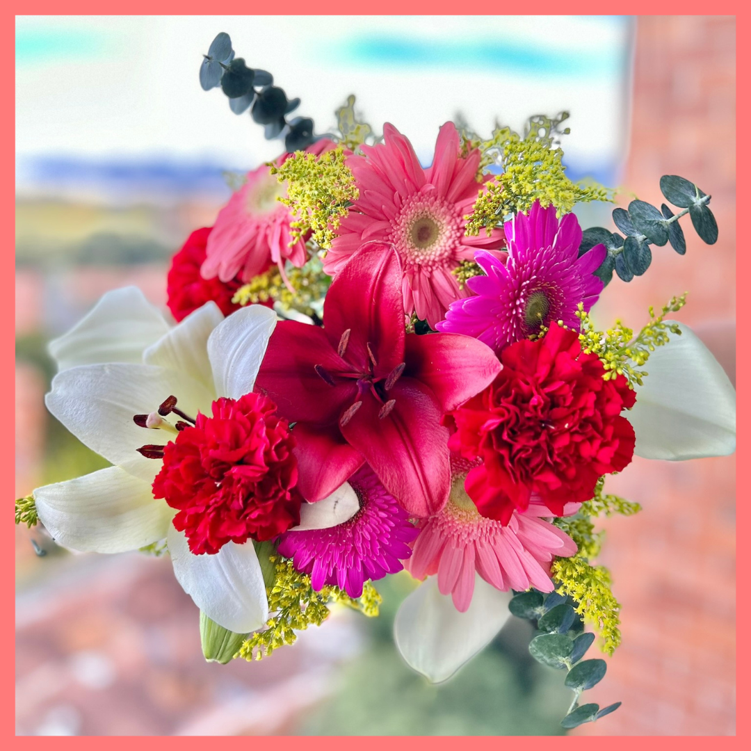 The Xmas Breeze bouquet includes mixed stems of lilies, gerbera daisies, mini callas, carnations, aster, and eucalyptus! Please note that as flowers are a live product, colors, and varieties may slightly vary from the photos shown to provide you with the freshest and most beautiful bouquet.