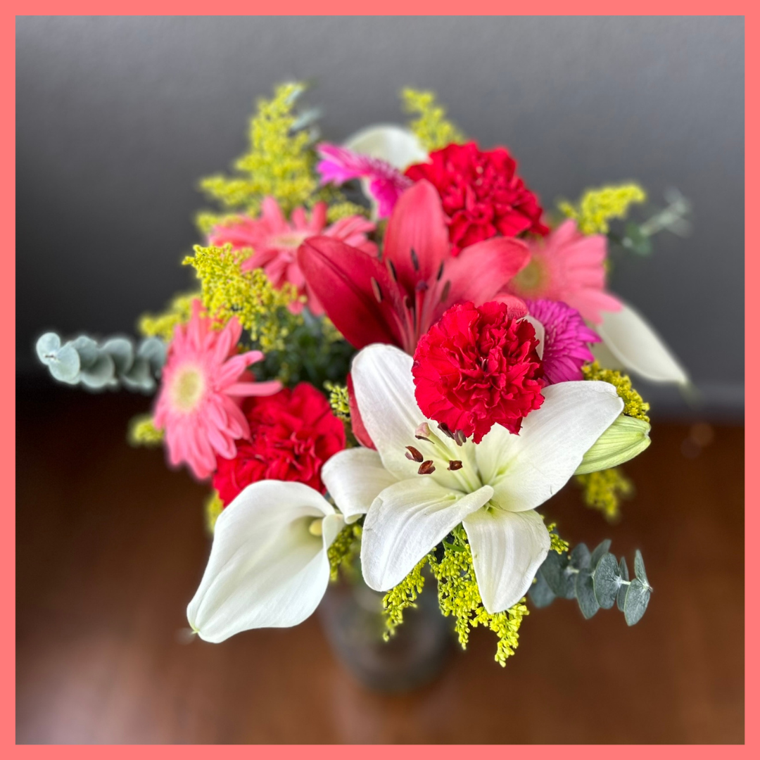 The Xmas Breeze bouquet includes mixed stems of lilies, gerbera daisies, mini callas, carnations, aster, and eucalyptus! Please note that as flowers are a live product, colors, and varieties may slightly vary from the photos shown to provide you with the freshest and most beautiful bouquet.