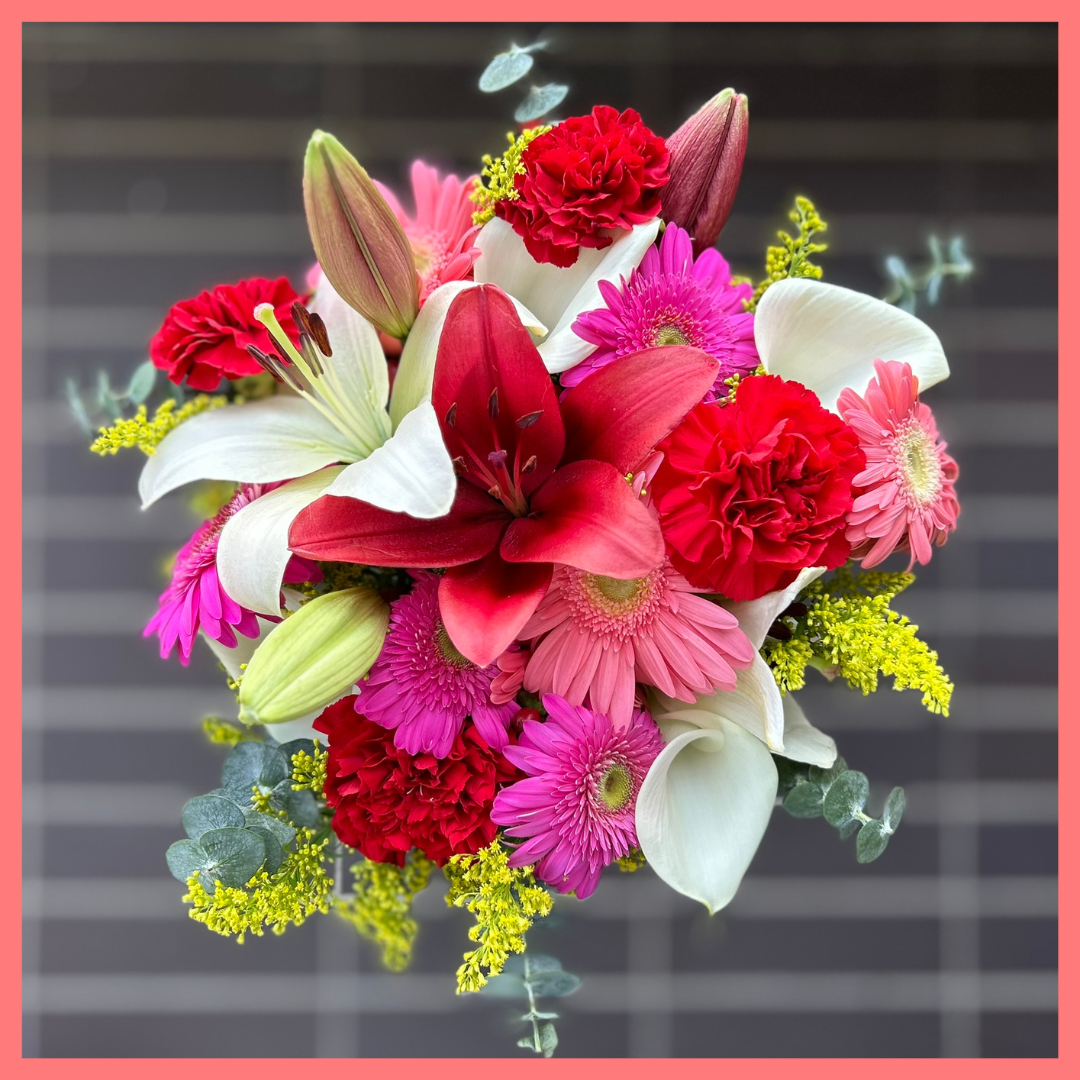 The Xmas Breeze bouquet includes mixed stems of lilies, gerbera daisies, mini callas, carnations, aster, and eucalyptus! Please note that as flowers are a live product, colors, and varieties may slightly vary from the photos shown to provide you with the freshest and most beautiful bouquet.