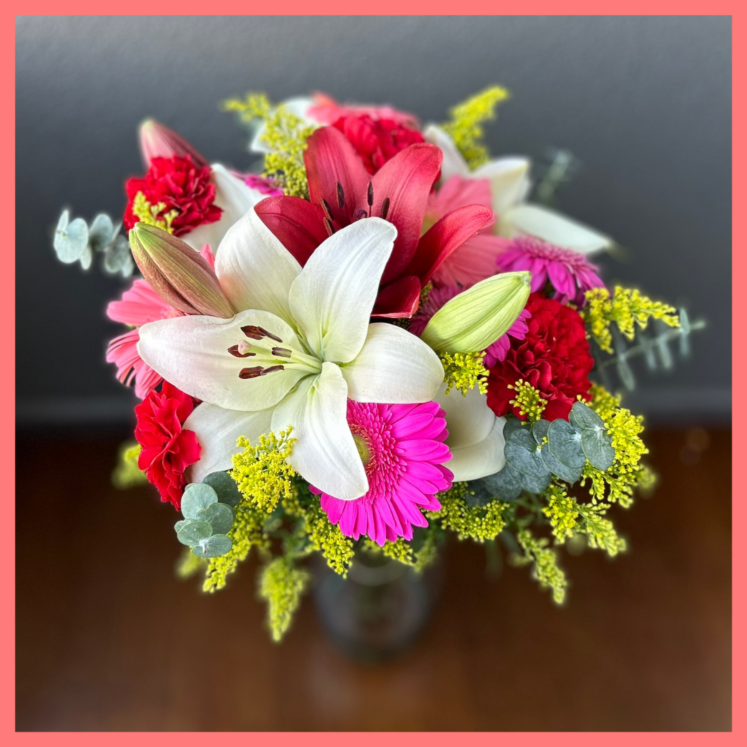 The Xmas Breeze bouquet includes mixed stems of lilies, gerbera daisies, mini callas, carnations, aster, and eucalyptus! Please note that as flowers are a live product, colors, and varieties may slightly vary from the photos shown to provide you with the freshest and most beautiful bouquet.
