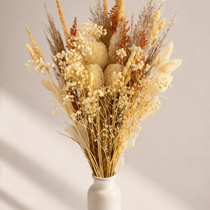Dried flower bouquet with gorso, loofah, orchard grass, pampas, ruscus, solidago, and typha in a vase