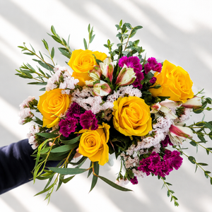 Golden Together flower bouquet with roses, lilliput, statice, alstroemeria, and eucalyptus