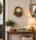 The Bronze Willow Wreath styled on a wall above a console table