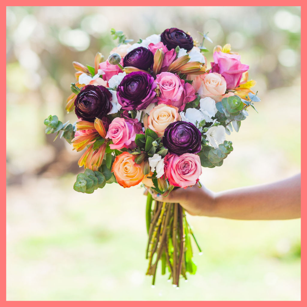 The Bundle of Joy flower bouquet includes mixed stems of ranunculus, roses, solomio, alstroemeria, and eucalyptus. Please note that as flowers are a live product, colors and varieties may slightly vary from the photos shown to provide you with the freshest and most beautiful bouquet.