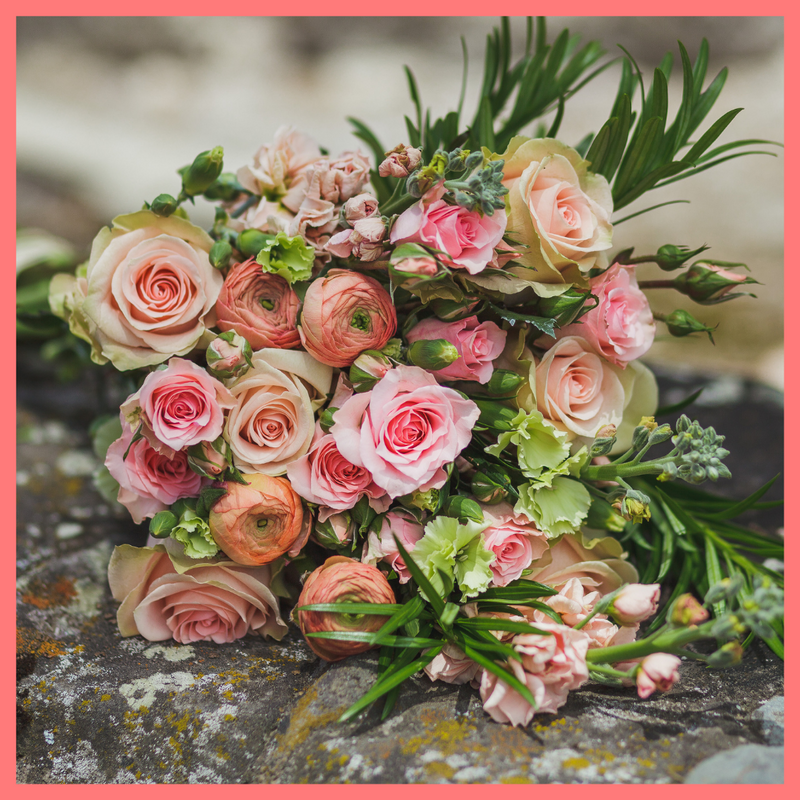 Order The Susie flower bouquet from our Mother's Day Collection.The Susie bouquet includes mixed stems of roses, coral ranunculus, stock, solomio, spray roses, and podocarpus greens. The flowers will be shipped directly from the farm to you!
