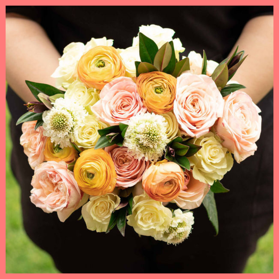Order the Bright and Toasty flower bouquet! The Bright and Toasty bouquet includes mixed stems of roses, ranunculus, scabiosa, solomio, and hebes. The flowers will be shipped directly from the farm to you!