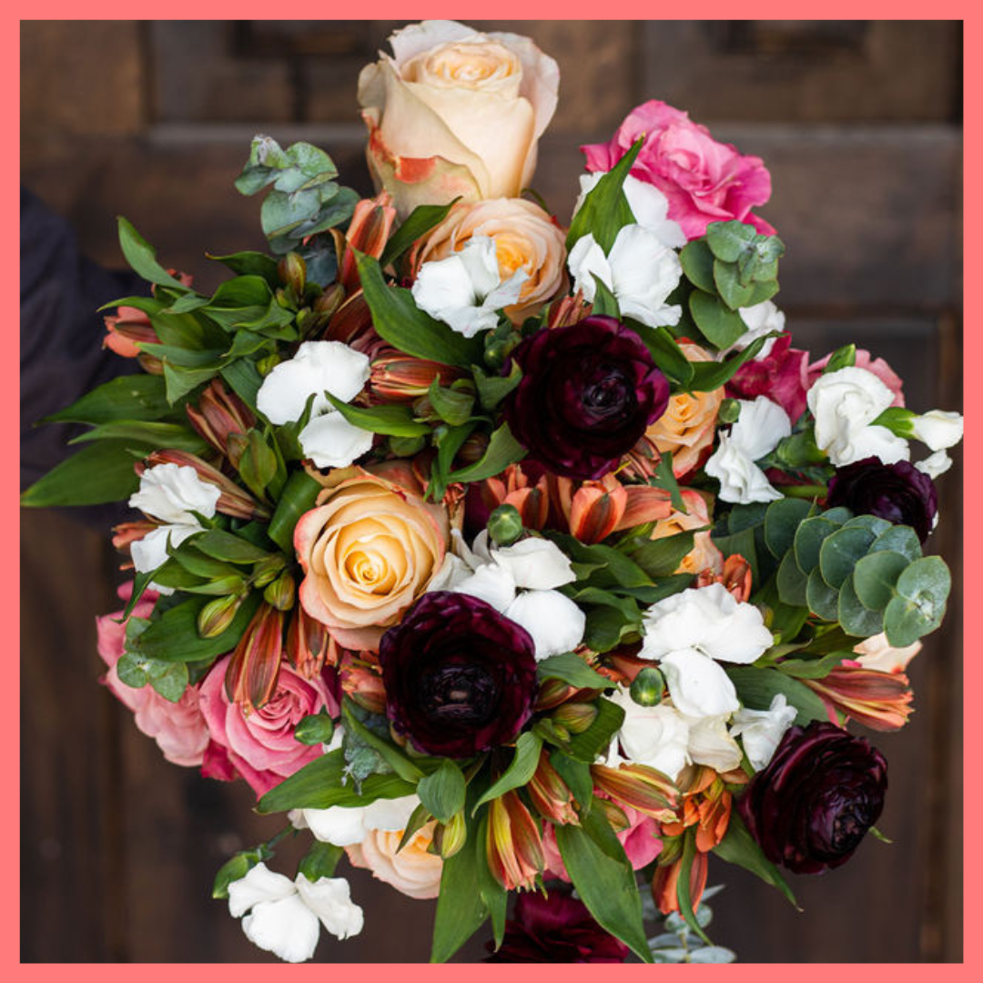The Bundle of Joy bouquet includes mixed stems of ranunculus, roses, solomio, alstroemeria, and eucalyptus. Please note that as flowers are a live product, colors and varieties may slightly vary from the photos shown to provide you with the freshest and most beautiful bouquet.