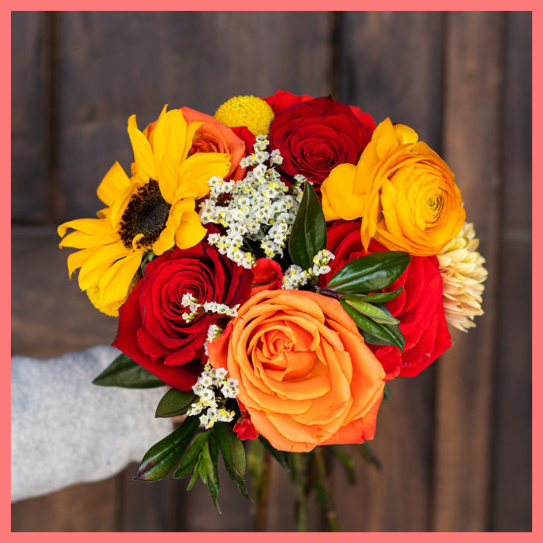 The Falling in Love bouquet includes mixed stems of sunflower, roses, chrysanthemums, ranunculus, craspedia, hebes, and limonium! Please note that as flowers are a live product, colors and varieties may slightly vary from the photos shown to provide you with the freshest and most beautiful bouquet.