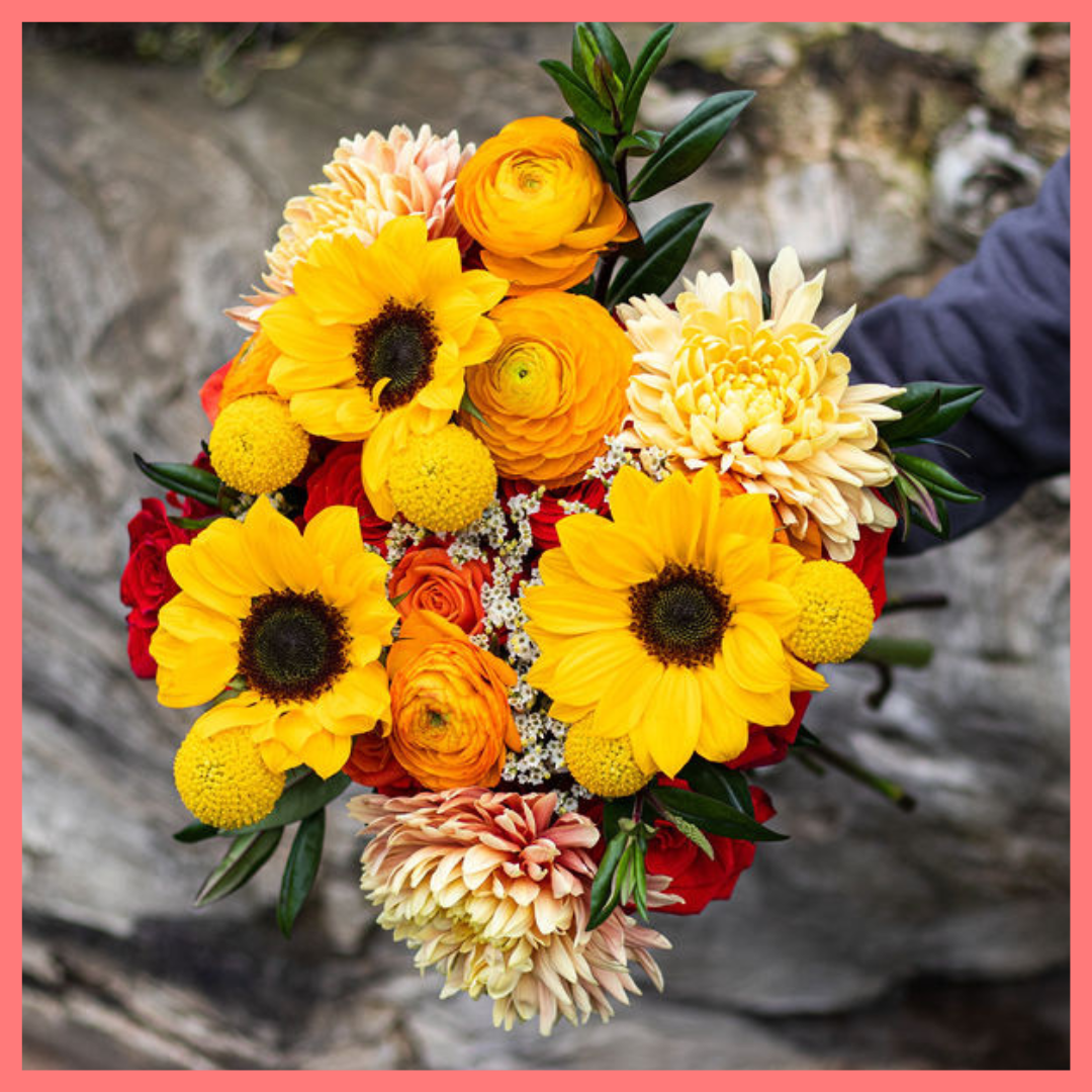 The Falling in Love bouquet includes mixed stems of sunflower, roses, chrysanthemums, ranunculus, craspedia, hebes, and limonium! Please note that as flowers are a live product, colors and varieties may slightly vary from the photos shown to provide you with the freshest and most beautiful bouquet.