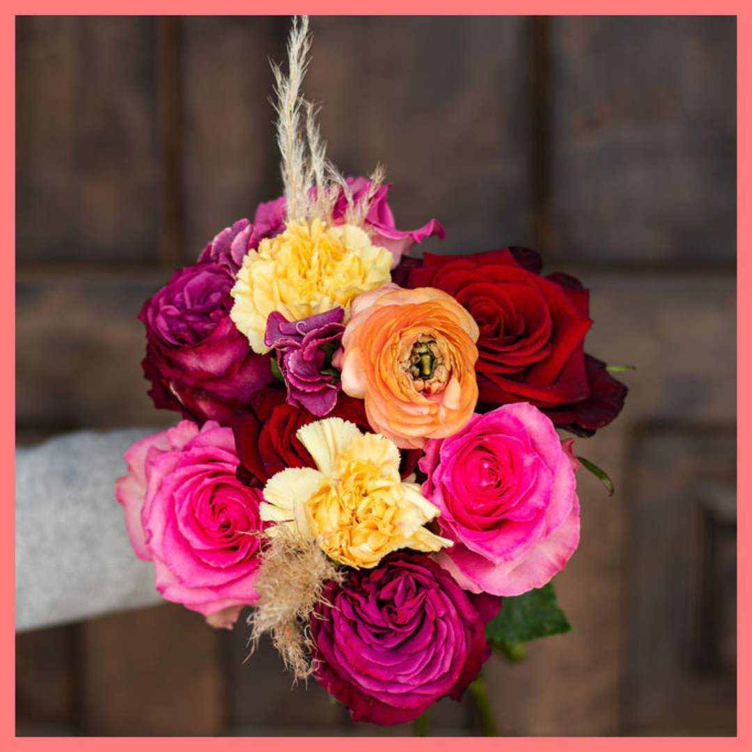 The Family Memories bouquet includes mixed stems of roses, ranunculus, carnation, solomio, and dried pampas! 