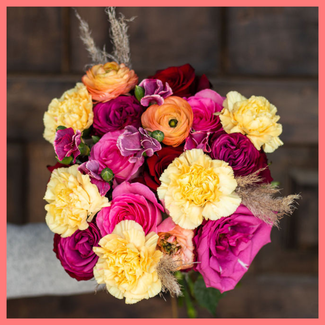 The Family Memories bouquet includes mixed stems of roses, ranunculus, carnation, solomio, and dried pampas! 
