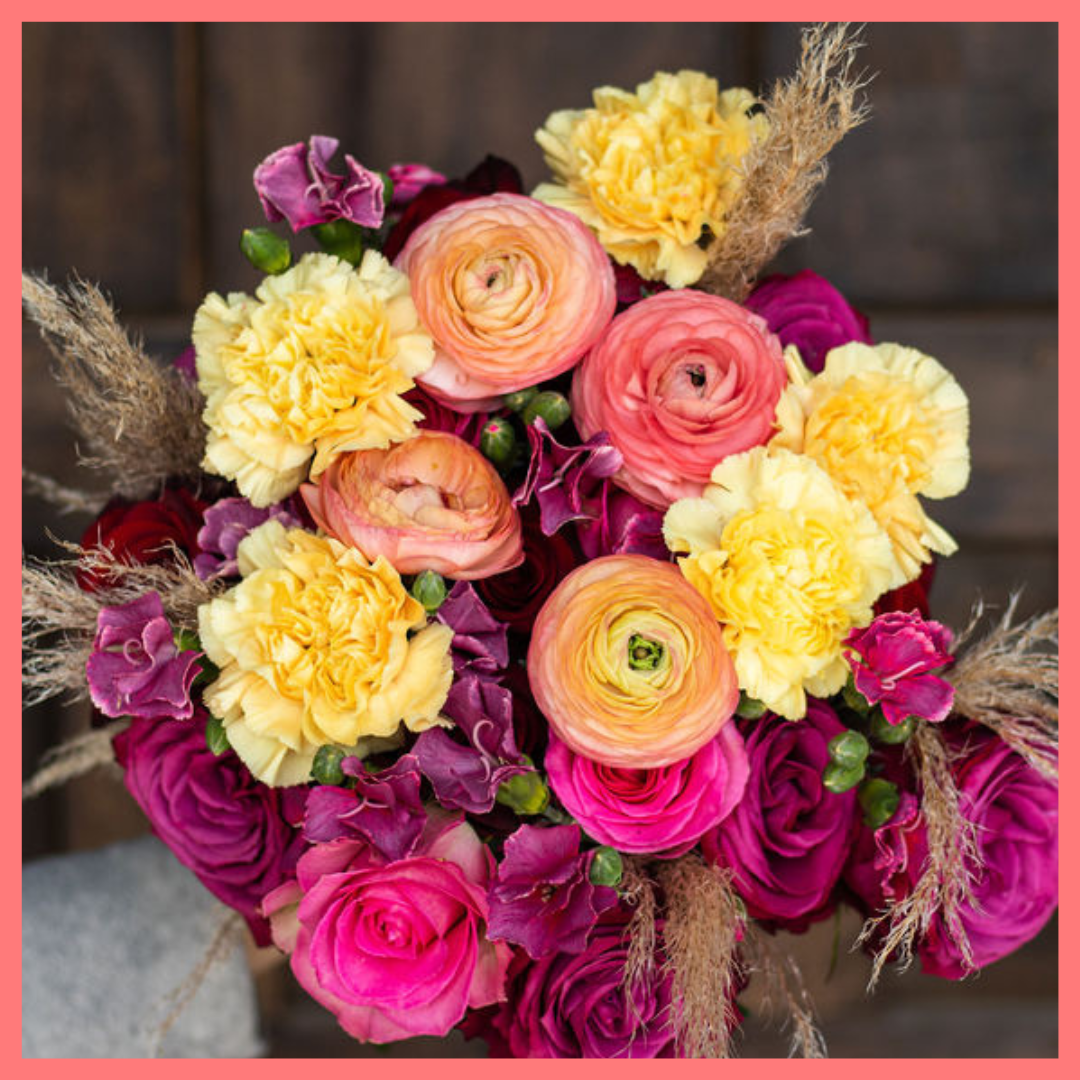 The Family Memories bouquet includes mixed stems of roses, ranunculus, carnation, solomio, and dried pampas! 