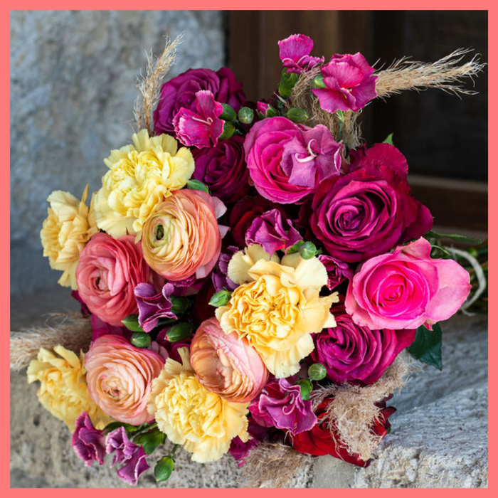 The Family Memories bouquet includes mixed stems of roses, ranunculus, carnation, solomio, and dried pampas! 