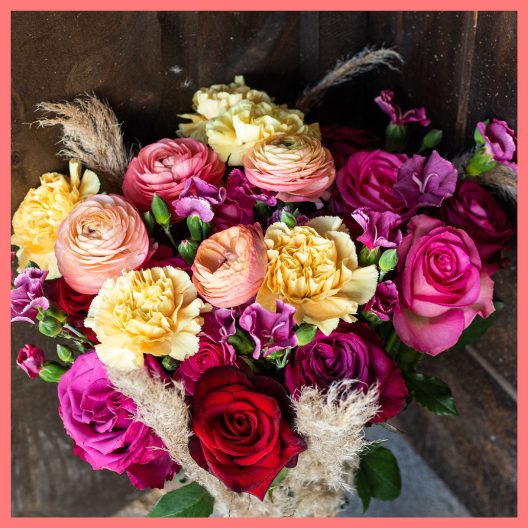 The Family Memories bouquet includes mixed stems of roses, ranunculus, carnation, solomio, and dried pampas! 