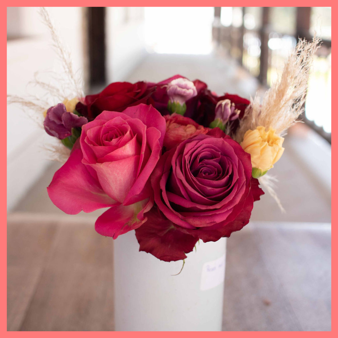 The Family Memories bouquet includes mixed stems of roses, ranunculus, carnation, solomio, and dried pampas!