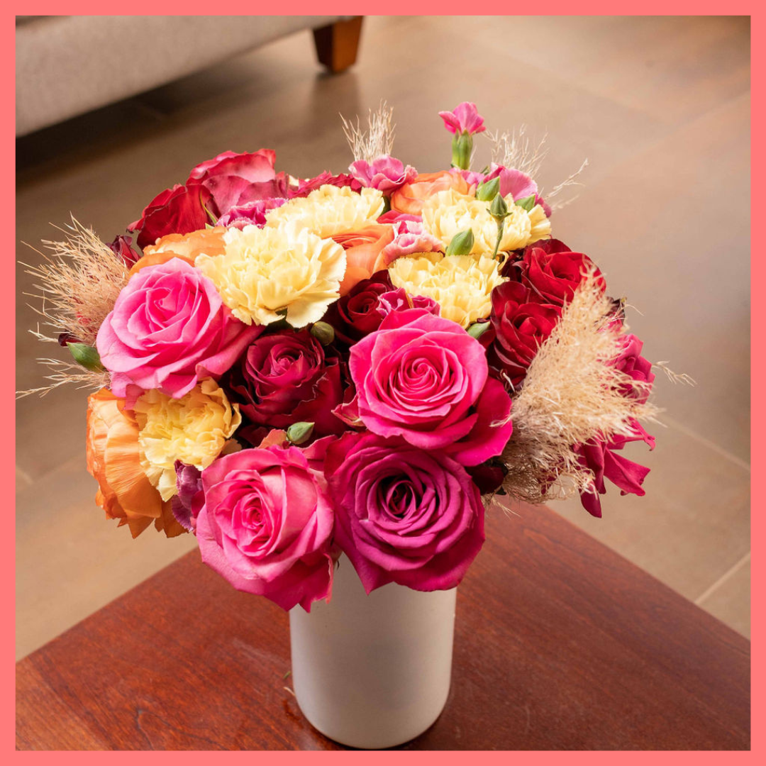 The Family Memories bouquet includes mixed stems of roses, ranunculus, carnation, solomio, and dried pampas!