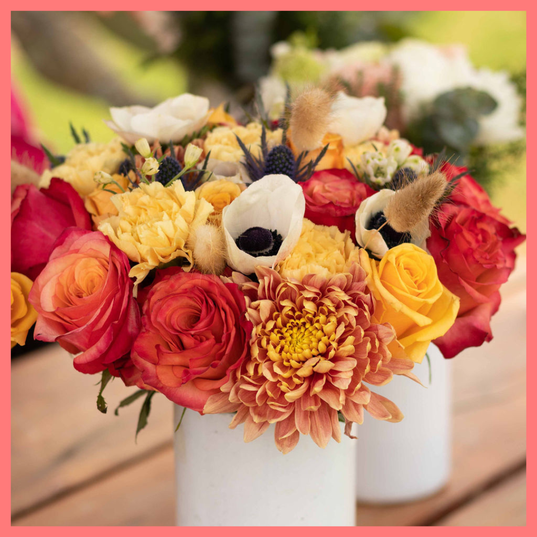 The Harvest Festival bouquet includes mixed stems of roses, anemone, delphinium, eryngium, chrysanthemums, bunny tail, and carnation!
