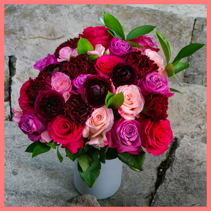 The Her Majesty bouquet includes mixed stems of roses, dianthus, carnations, ranunculus, and ruscus. Please note that as flowers are a live product, colors and varieties may slightly vary from the photos shown to provide you with the freshest and most beautiful bouquet.