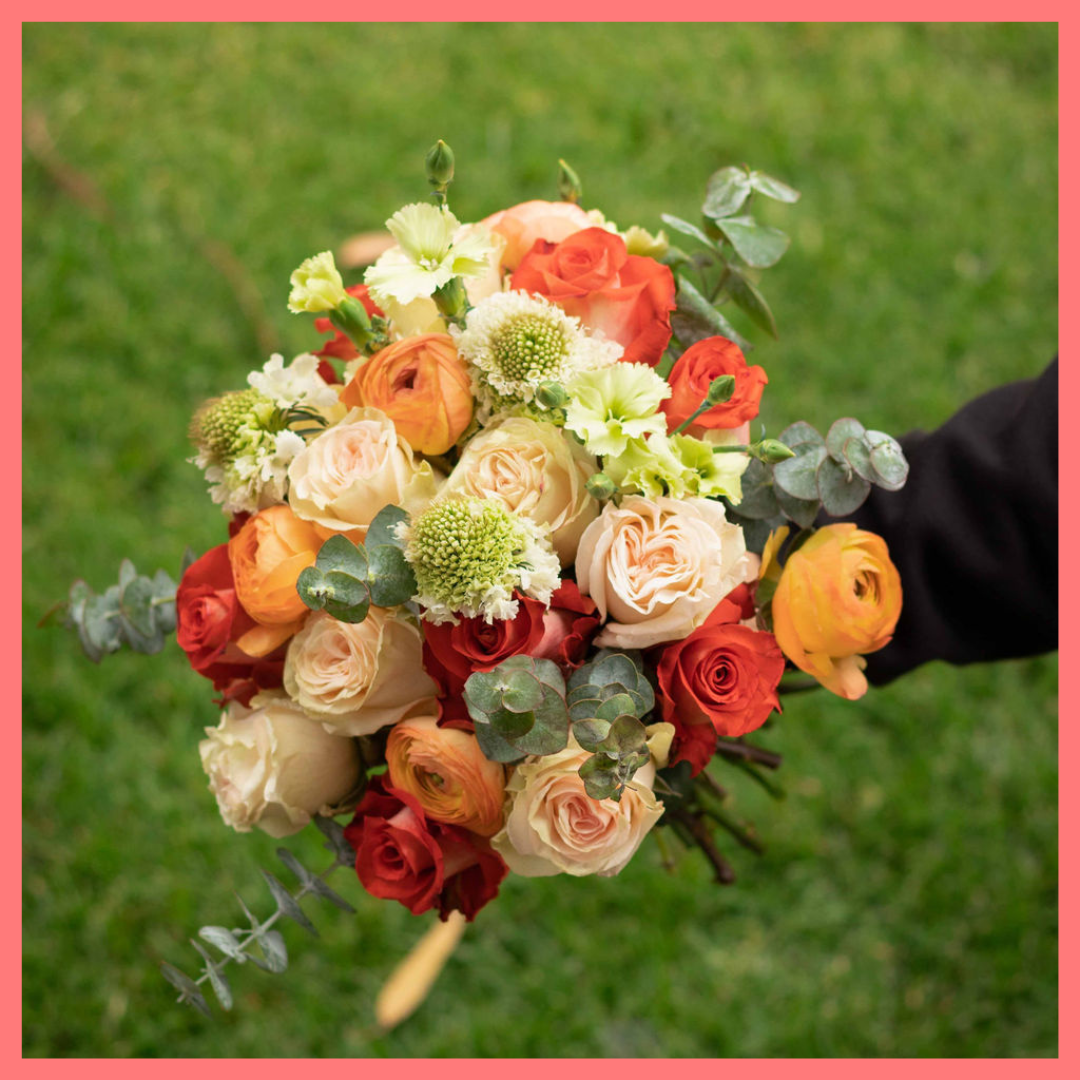 Order the Pretty and Festive flower bouquet! The Pretty and Festive bouquet includes mixed stems of roses, ranunculus, scabiosa, solomio, and eucalyptus. The flowers will be shipped directly from the farm to you!