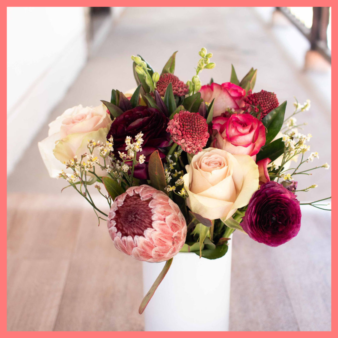 Order the Roses and Snowflakes flower bouquet! The Roses and Snowflakes flower bouquet includes roses, hebes, scabiosa, larkspur, protea, and limonium. Please note that as flowers are a live product, colors and varieties may slightly vary from the photos shown to provide you with the freshest and most beautiful bouquet.