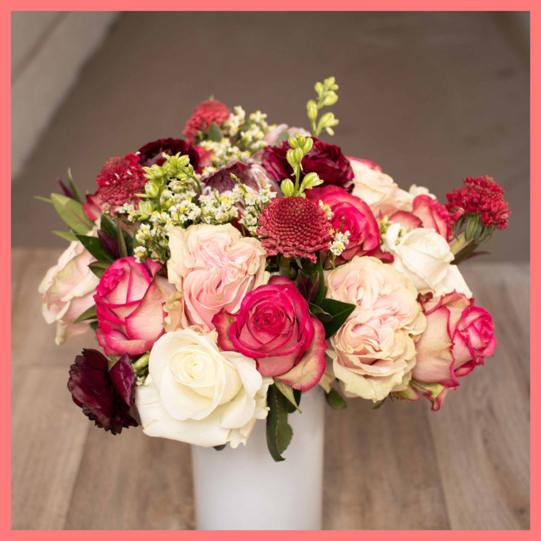 Order the Roses and Snowflakes flower bouquet! The Roses and Snowflakes flower bouquet includes roses, hebes, scabiosa, larkspur, protea, and limonium. Please note that as flowers are a live product, colors and varieties may slightly vary from the photos shown to provide you with the freshest and most beautiful bouquet.