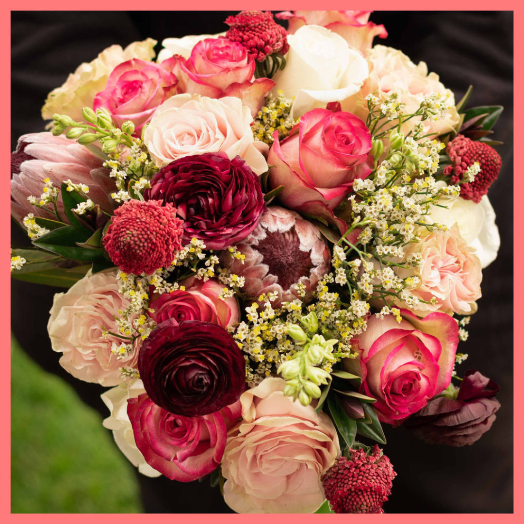 Order the Roses and Snowflakes flower bouquet! The Roses and Snowflakes flower bouquet includes roses, hebes, scabiosa, larkspur, protea, and limonium. Please note that as flowers are a live product, colors and varieties may slightly vary from the photos shown to provide you with the freshest and most beautiful bouquet.