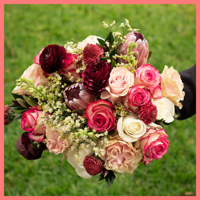 Order the Roses and Snowflakes flower bouquet! The Roses and Snowflakes flower bouquet includes roses, hebes, scabiosa, larkspur, protea, and limonium. Please note that as flowers are a live product, colors and varieties may slightly vary from the photos shown to provide you with the freshest and most beautiful bouquet.
