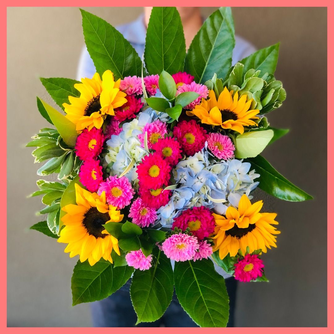 The You Blue My Mind bouquet includes mixed stems of sunflowers, hydrangea, matsumoto, ruscus, viburnum, lily grass, aralia, and pittosporum! Please note that as flowers are a live product, colors, and varieties may slightly vary from the photos shown to provide you with the freshest and most beautiful bouquet.