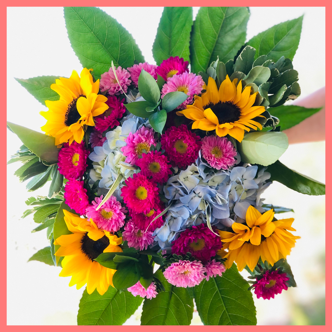 The You Blue My Mind bouquet includes mixed stems of sunflowers, hydrangea, matsumoto, ruscus, viburnum, lily grass, aralia, and pittosporum! Please note that as flowers are a live product, colors, and varieties may slightly vary from the photos shown to provide you with the freshest and most beautiful bouquet.
