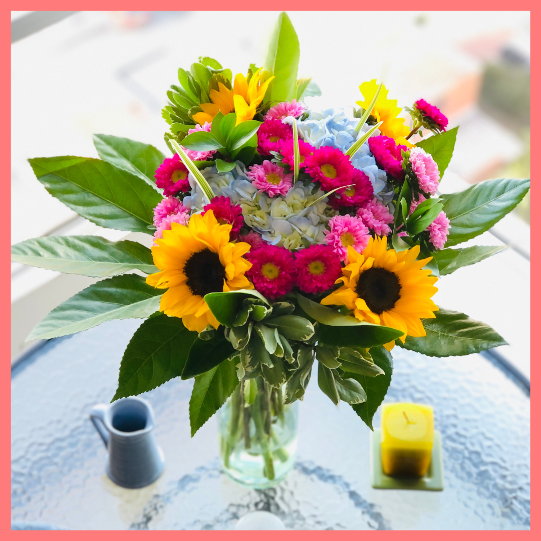 The You Blue My Mind bouquet includes mixed stems of sunflowers, hydrangea, matsumoto, ruscus, viburnum, lily grass, aralia, and pittosporum! Please note that as flowers are a live product, colors, and varieties may slightly vary from the photos shown to provide you with the freshest and most beautiful bouquet.