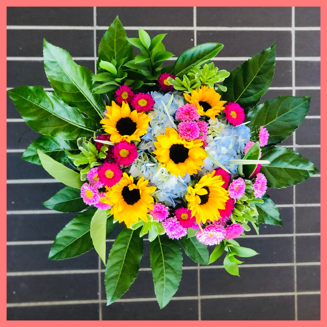 The You Blue My Mind bouquet includes mixed stems of sunflowers, hydrangea, matsumoto, ruscus, viburnum, lily grass, aralia, and pittosporum! Please note that as flowers are a live product, colors, and varieties may slightly vary from the photos shown to provide you with the freshest and most beautiful bouquet.