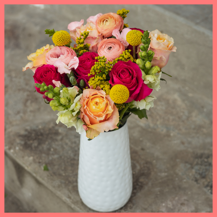 The Birthday Wish bouquet includes mixed stems of ranunculus, roses, solidago, snapdragons, solomio, and craspedia. Please note that as flowers are a live product, colors and varieties may slightly vary from the photos shown to provide you with the freshest and most beautiful bouquet.