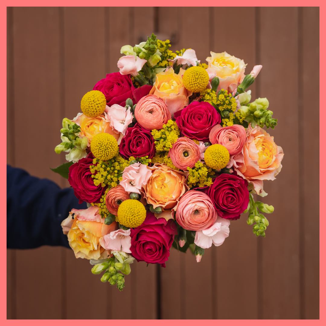 Order the My Dear flower bouquet. The My Dear bouquet includes mixed stems of ranunculus, roses, solidago, snapdragons, solomio, and craspedia. Vase included. The flowers will be shipped directly from the farm to you!