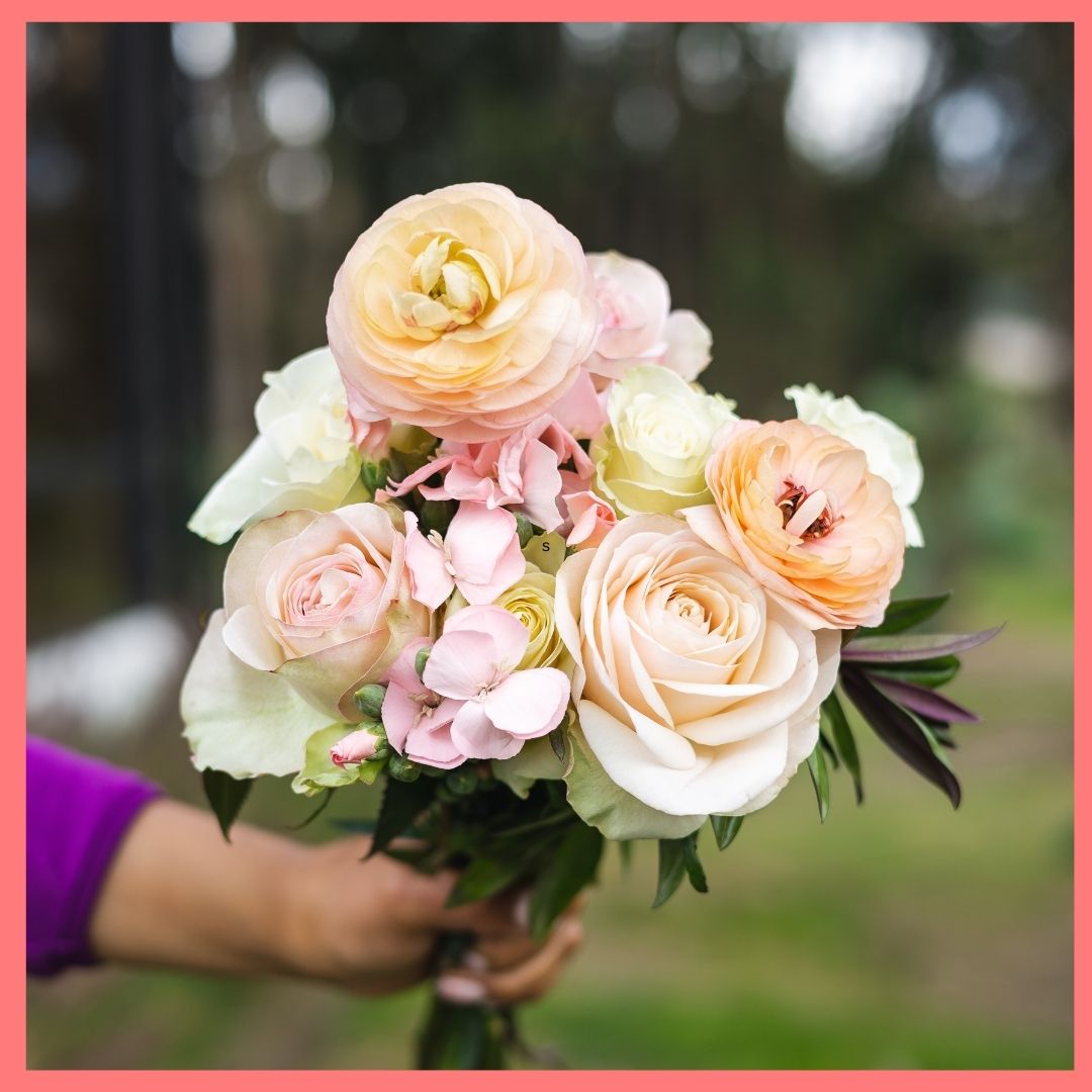 Order the Bright and Toasty flower bouquet! The Bright and Toasty bouquet includes mixed stems of roses, ranunculus, scabiosa, solomio, and hebes. The flowers will be shipped directly from the farm to you!