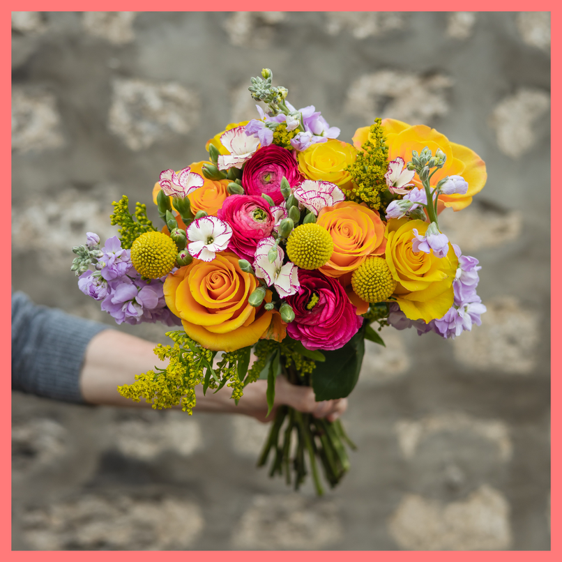 Order the Celebrate Good Times flower bouquet! The Celebrate Good Times bouquet includes mixed stems of craspedia, ranunculus, stock, roses, solomio, and solidago. The flowers will be shipped directly from the farm to you!