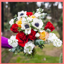 Load image into Gallery viewer, The Growers&#39; Choice - Christmas Flower Bouquet includes mixed stems of lilies, calla lilies, gerbera daisies, hypericum, schlefflera, chrysanthemums, and eryngium. Please note that as flowers are a live product, colors and varieties may slightly vary from the photos shown to provide you with the freshest and most beautiful bouquet.
