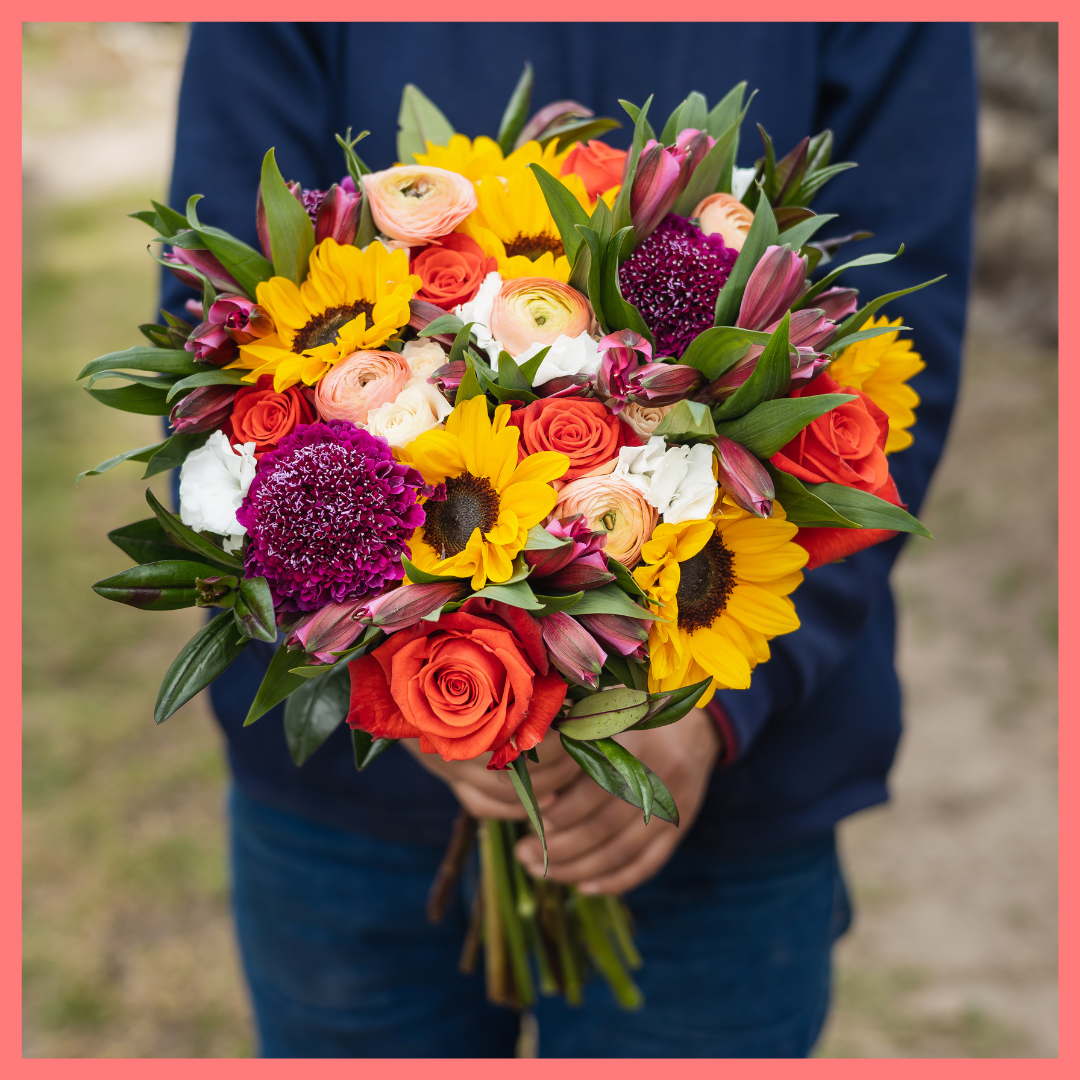 The Sunkissed bouquet includes mixed stems of ranunculus, sunflowers, roses, spray roses, alstroemeria, solomio, scabiosa, and hebes. Scabiosa only included in Lux and Premier sizes. Please note that as flowers are a live product, colors and varieties may slightly vary from the photos shown to provide you with the freshest and most beautiful bouquet.