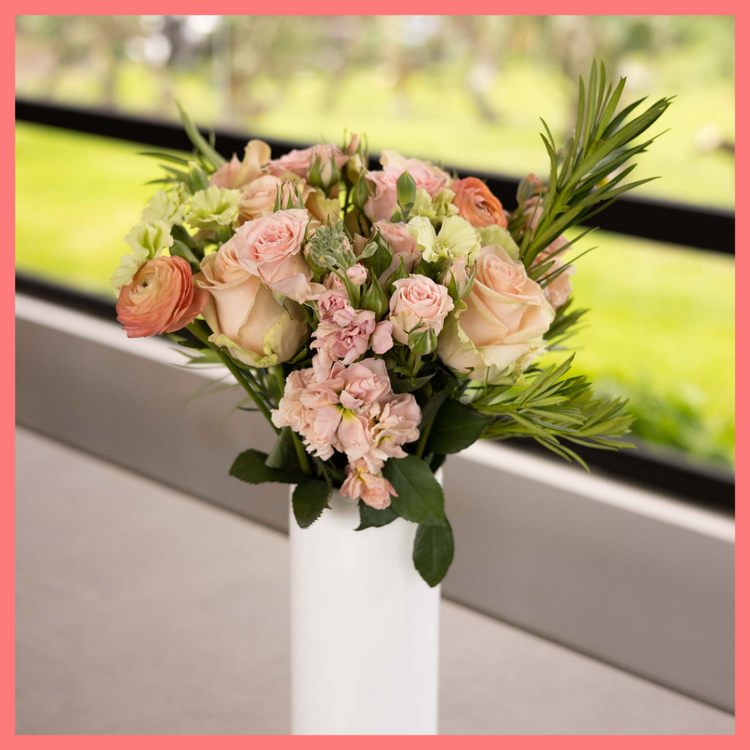The Susie bouquet includes mixed stems of ranunculus, roses, spray roses, stock, solomio, and podocarpus. Please note that as flowers are a live product, colors and varieties may slightly vary from the photos shown to provide you with the freshest and most beautiful bouquet.